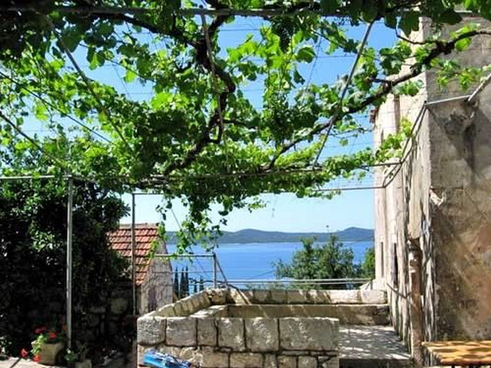 A stone building with a view of the sea.