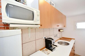 Apartment (A1) | Private kitchen | Fridge, microwave, oven, espresso maker