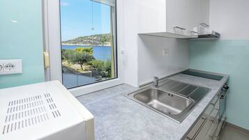 Apartment (A3) | Private kitchen | Espresso maker, fridge, microwave, oven