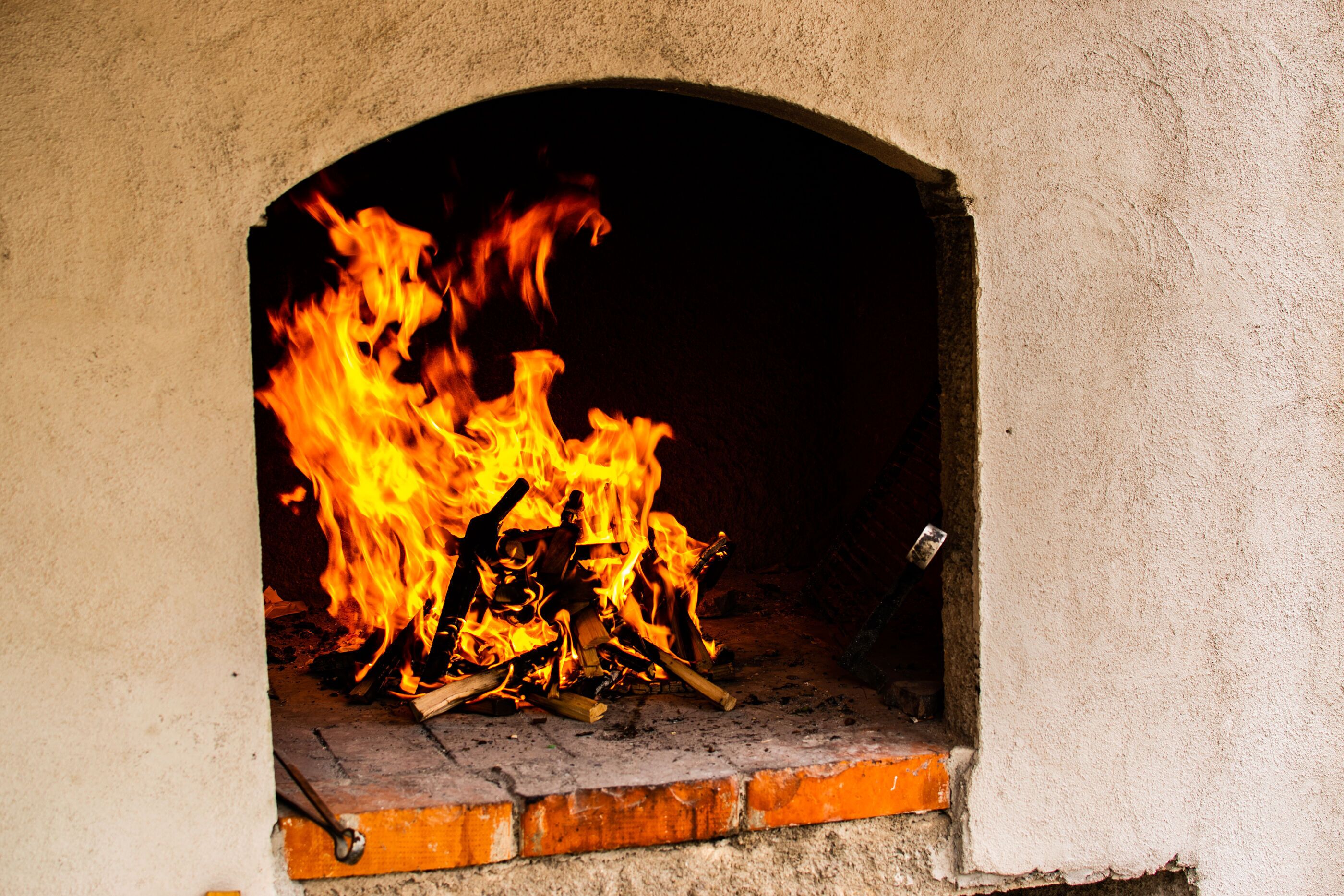 A fireplace with a fire burning inside.