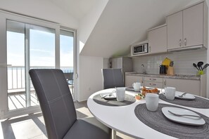 Apartment (A2) | Private kitchen | Fridge, microwave, stovetop, electric kettle - Apartments Danolic (Omis)