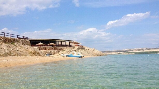A coastal building with a balcony overlooking a clear blue sea. - House Goran (Kolan)