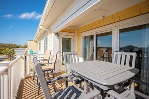 Outdoor dining - Sea Tales: Ocean View Condo with Community Pool, Hot Tub, Across from OKI Pier (Oak Island)