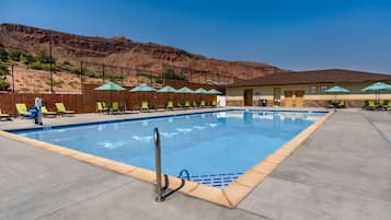 Seasonal outdoor pool, open 9:30 AM to 10:00 PM, pool umbrellas