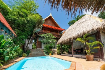 The villa features a private salt water pool, outdoor and indoor lounging area.