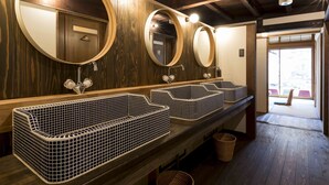 A public restroom with three sinks, each with a large mirror and a small trash bin. - Guest House Maru ‐Hostel (Kashima)