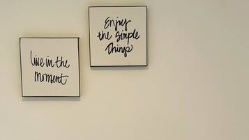 Two framed inspirational quotes on a wall.