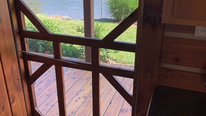 A wooden deck with a view of a lake and a sign reading "Lake View."