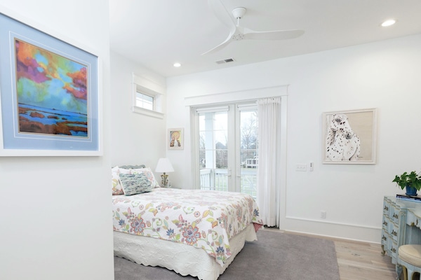 East Suite. Queen. French doors to balcony. Ceiling fan. Original paintings/art.