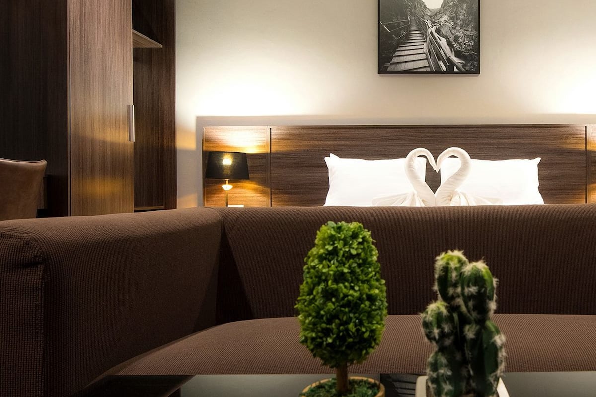 superior double room | living area | flat-screen tv