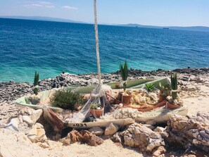 Beach nearby, sun loungers