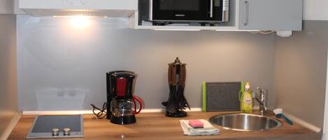 Fridge, microwave, stovetop, coffee/tea maker