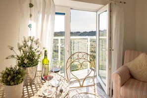 Enjoy a scenic view of the surrounding hills from the balcony, where you can dine or socialize with a glass of wine.
