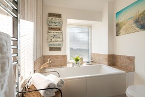 Bathtub, hair dryer, towels