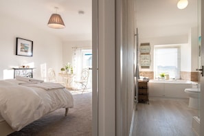 Bright upstairs landing connecting the master bedroom, twin bedroom and family bathroom, cottage sleeping six in Rhosneigr, Anglesey