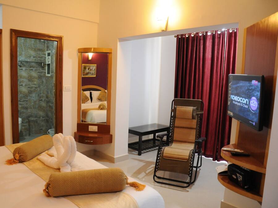 1 habitación y tabla de planchar con plancha