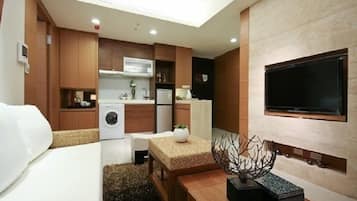 Family Apartment, 2 Bedrooms, Smoking (Romantic) | Living area | Flat-screen TV