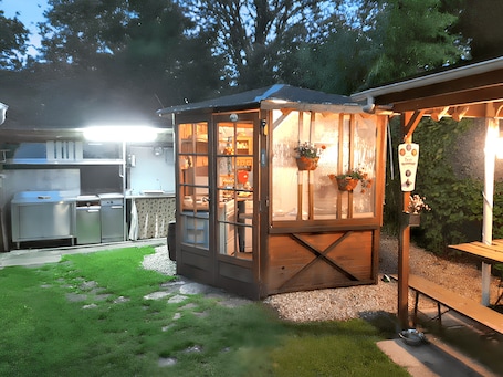 Outdoor dining. Homerez - Charming Chalet with Pool in Molinot