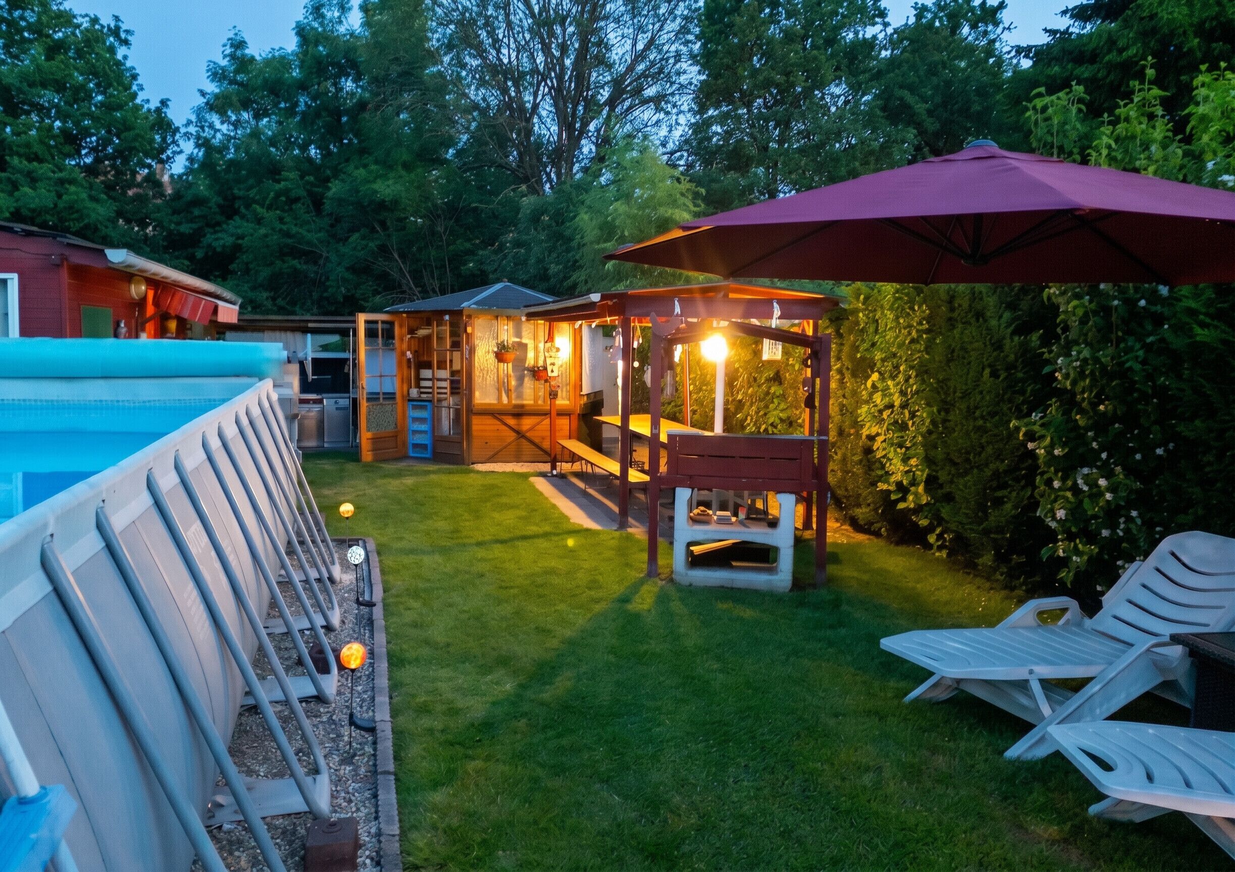 A backyard with a pool, a wooden playhouse, and a patio area with lounge chairs and a table.