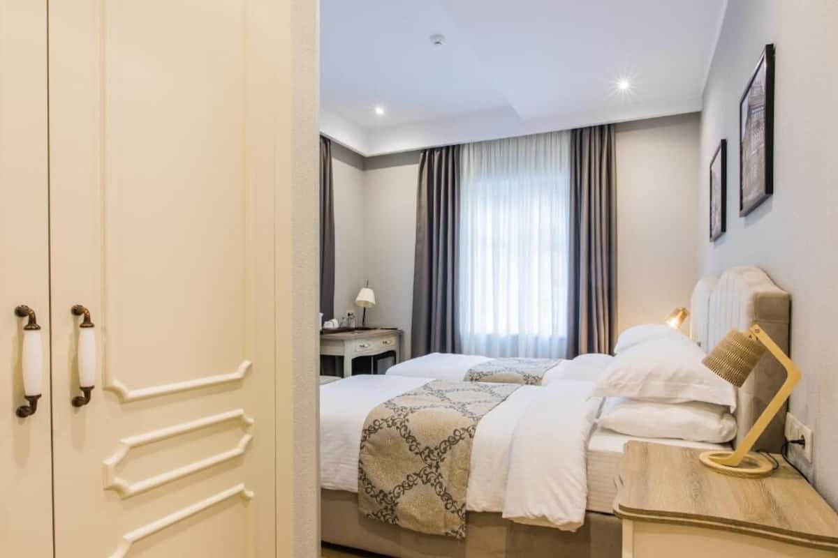 Twin Room, 1 Double Bed, Corner | 1 bedroom, premium bedding, minibar, in-room safe