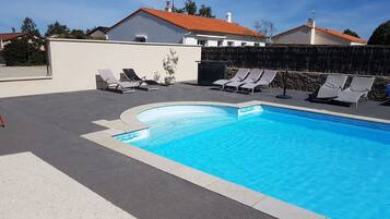 Seasonal outdoor pool, open 4:00 PM to 8:00 PM, pool umbrellas