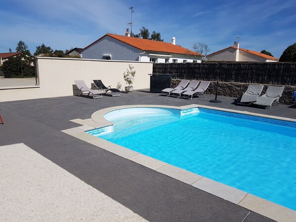 Seasonal outdoor pool, open 4:00 PM to 8:00 PM, pool umbrellas