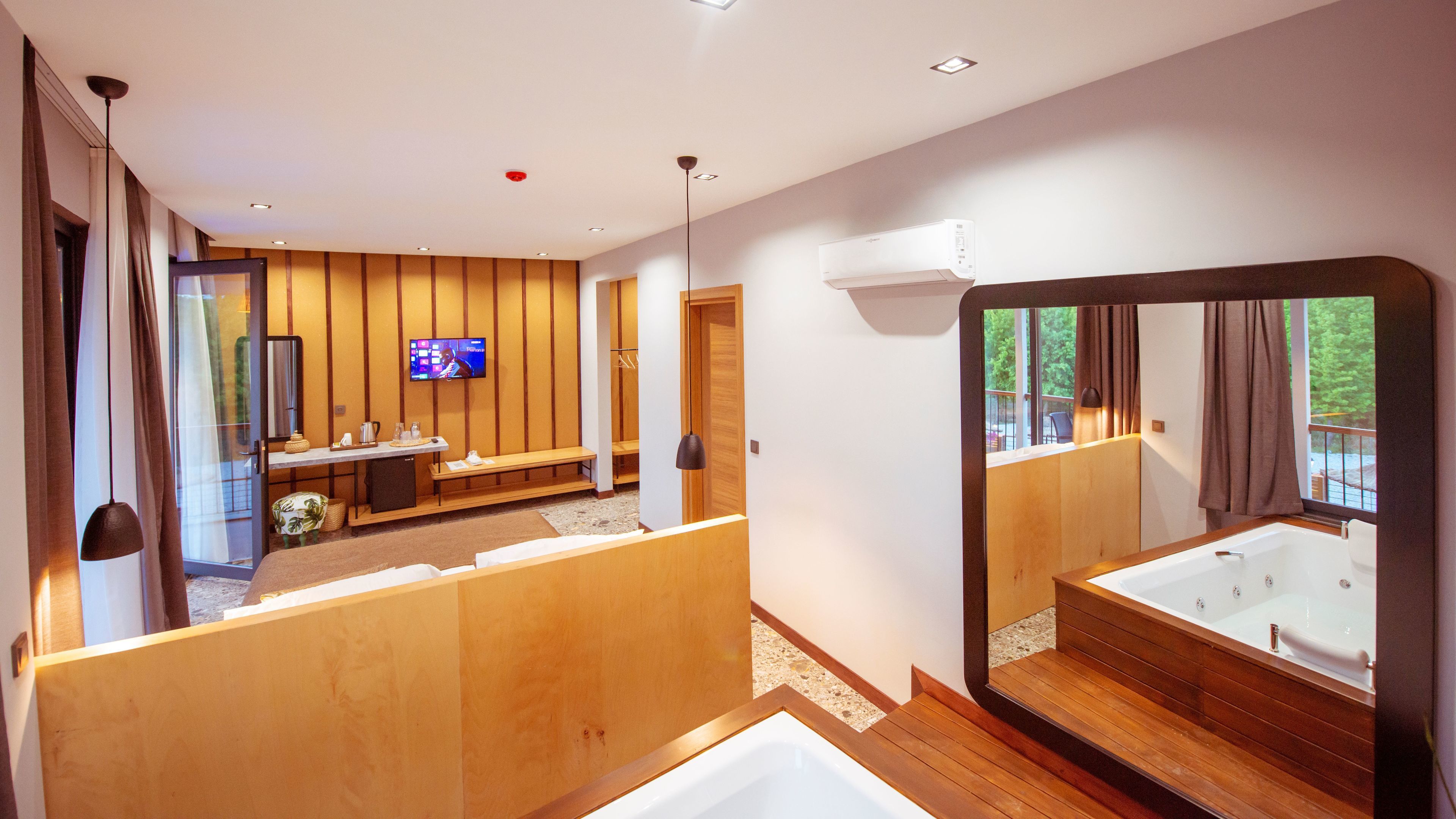 deluxe room, jetted tub, pool view | private spa tub