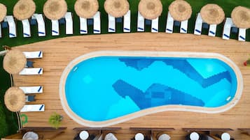 Seasonal outdoor pool, open 8:00 AM to 8:00 PM, pool umbrellas