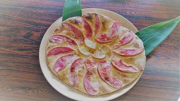 A round plate with a dessert on a wooden table.