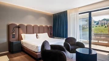 Premium bedding, down comforters, pillowtop beds, minibar