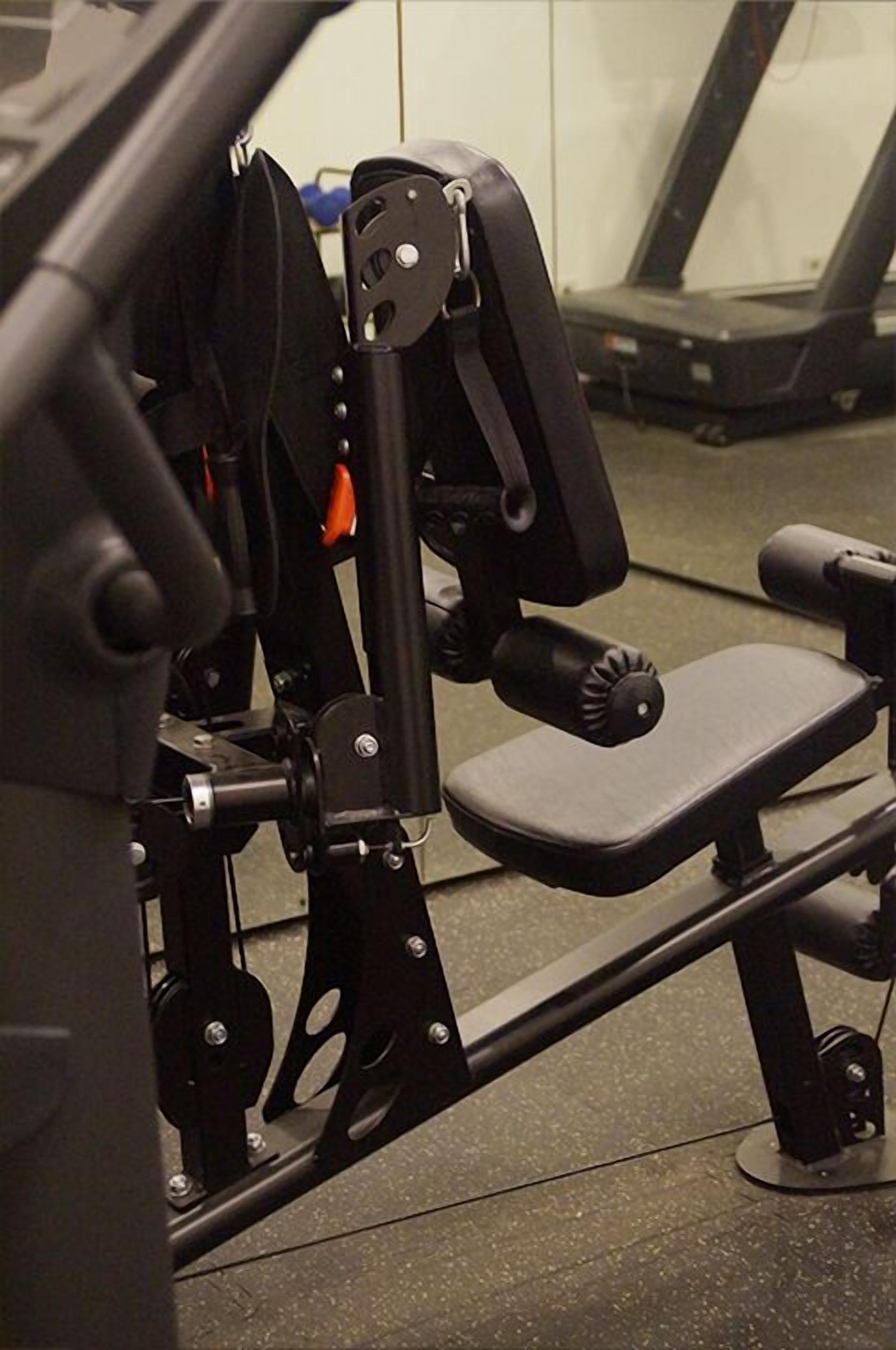 A gym equipment setup with a bench and a weight machine.