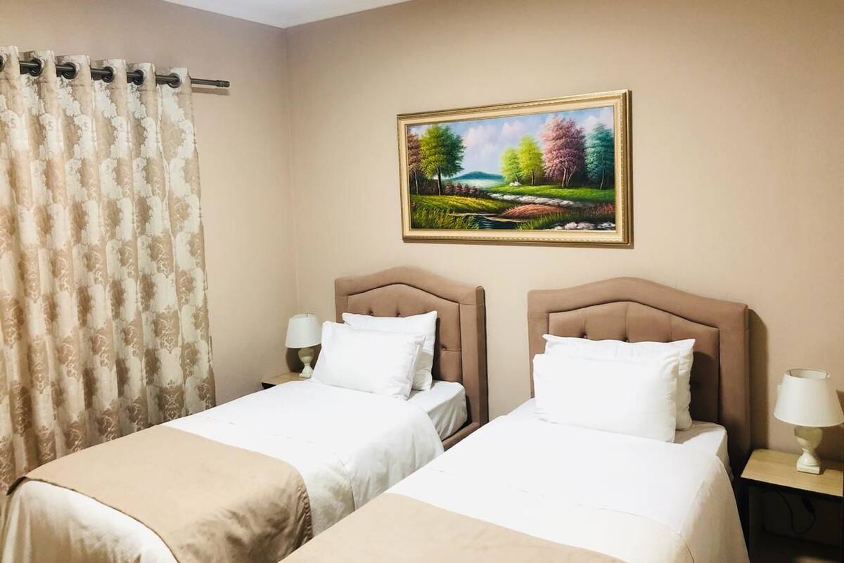 Basic Twin Room, 1 Bedroom, City View | Iron/ironing board (on request), WiFi (free), bed sheets