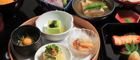 A variety of Japanese dishes arranged on a tray.