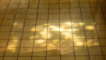 A tiled floor with a grid pattern.