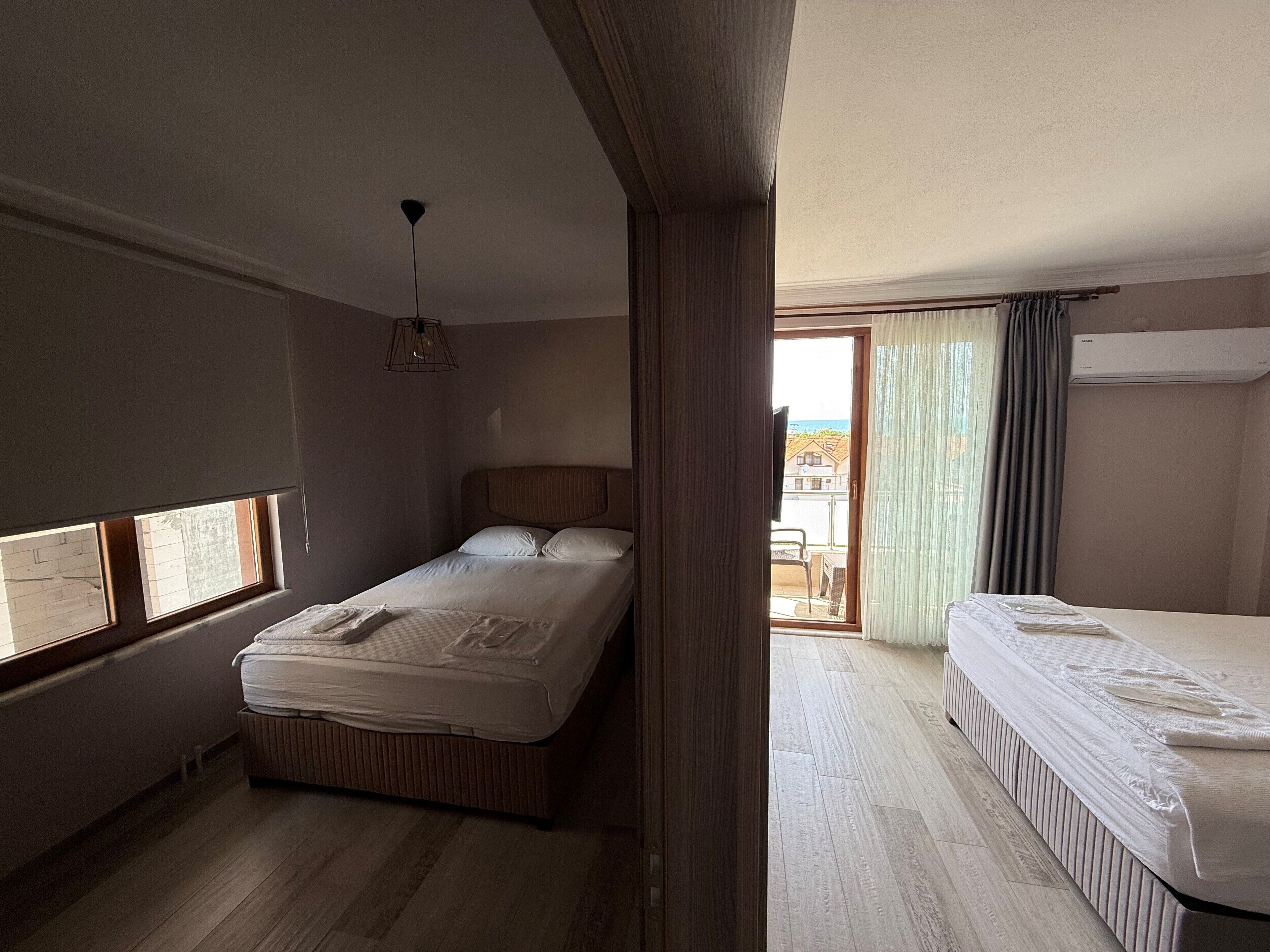 family room | 2 bedrooms, blackout curtains, bed sheets