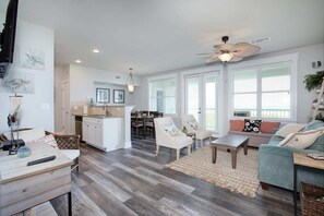 Cozy living space with a kitchen, dining area, and comfortable seating.