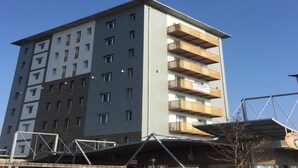 A multi-story building with a mix of balconies and windows. - The Residence Galliate (Galliate)