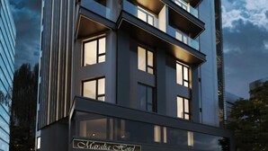 A modern hotel with a prominent sign reading "Maralia Hotel." It features a multi-story structure with balconies and large windows. - Maralia Hotel (Nicosia)