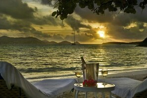 On the beach, sun loungers, beach towels