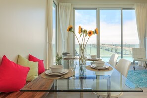 Enjoy ocean views from the dining area with a clear view of the pier.