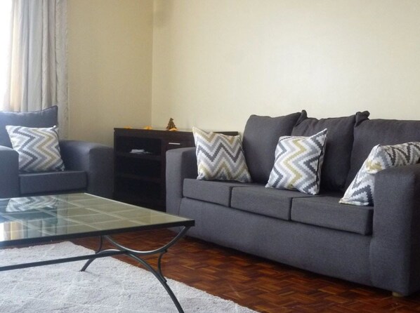 Comfort Apartment, 2 Bedrooms | Living area | 32-inch flat-screen TV with satellite channels, TV - Sheema Villas (Nairobi)