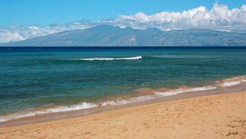 On the beach, sun loungers, beach towels