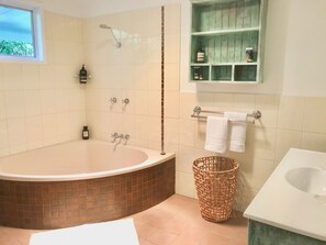 Bathtub, eco-friendly toiletries, hair dryer, towels