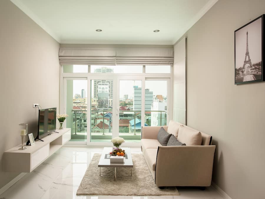 Deluxe Apartment | Living area | 32-inch LCD TV with premium channels, TV, Netflix