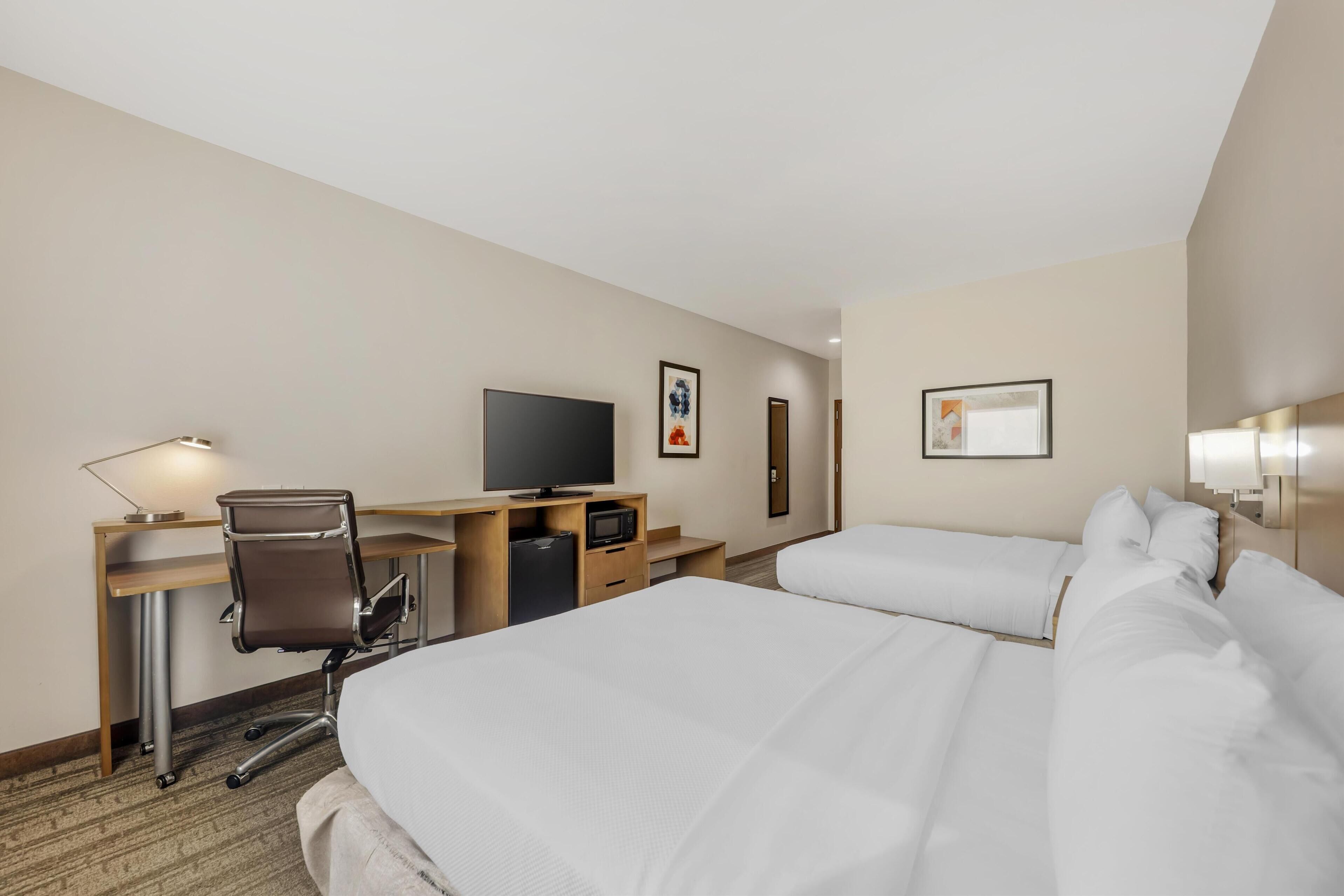 standard room, 2 queen beds, non smoking, refrigerator & microwave | 1 bedroom, desk, laptop workspace, blackout curtains