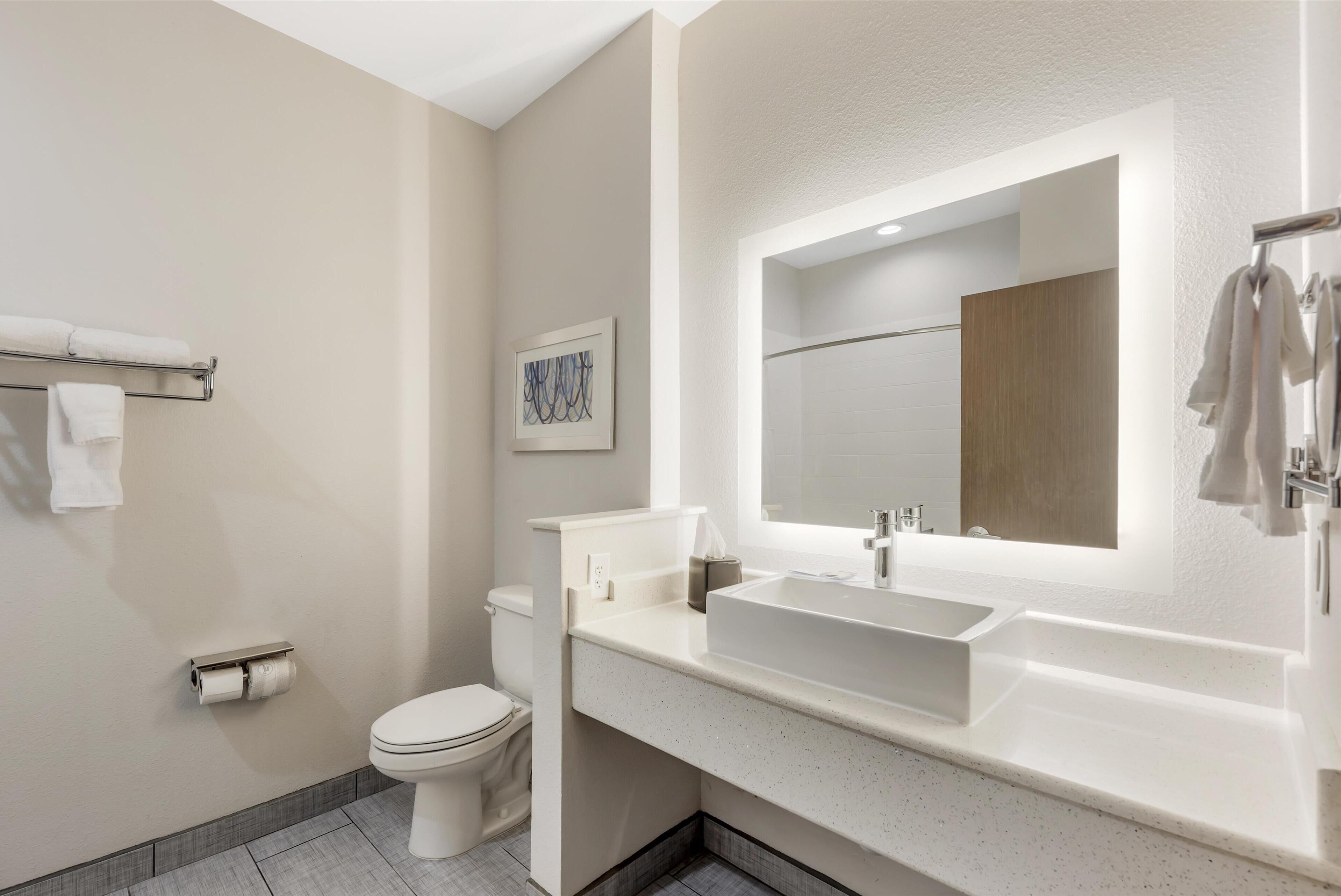 suite, 1 king bed, non smoking, refrigerator & microwave | bathroom | combined shower/bathtub, free toiletries, hair dryer, towels
