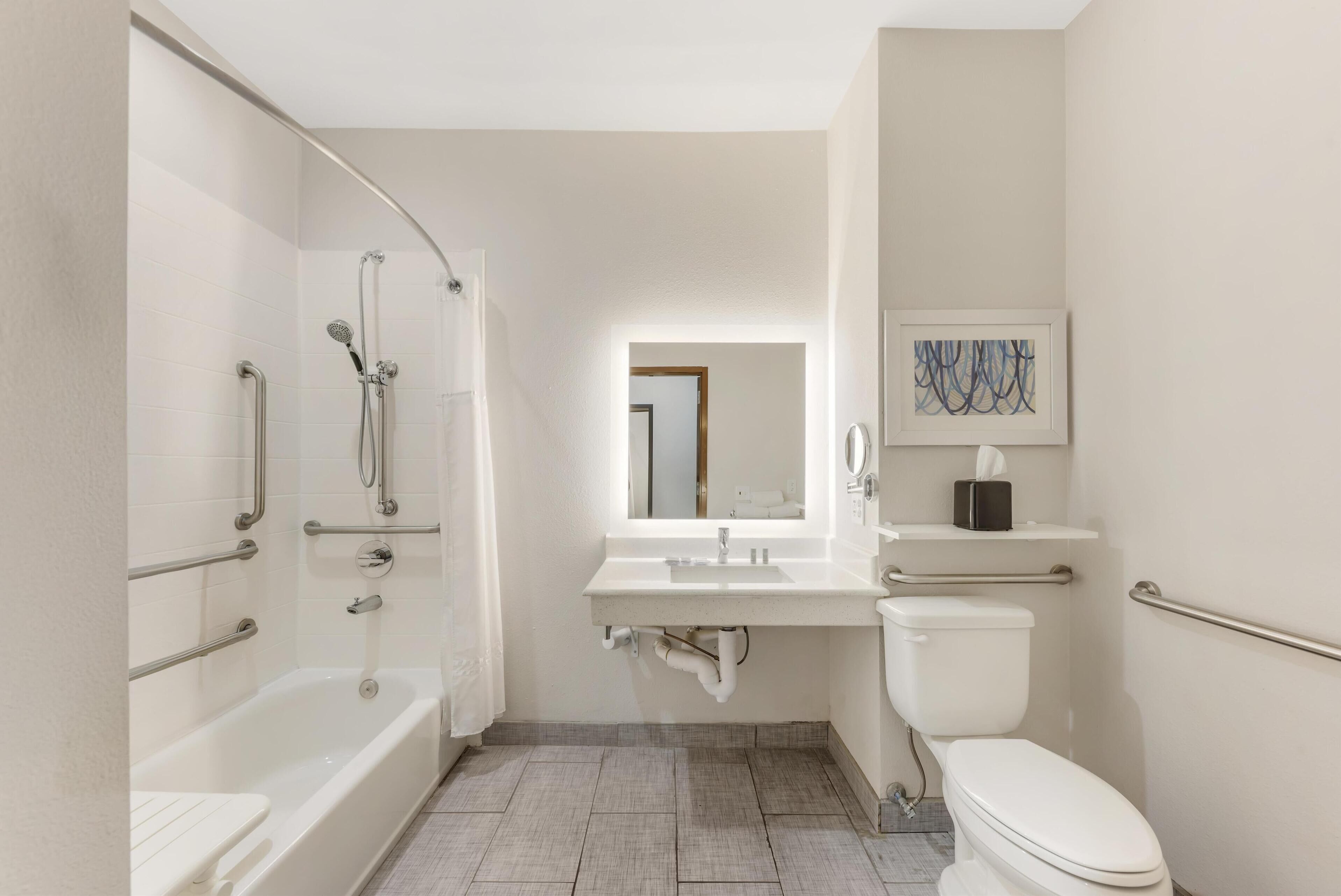 suite, 1 king bed, accessible, refrigerator & microwave | bathroom | combined shower/bathtub, free toiletries, hair dryer, towels
