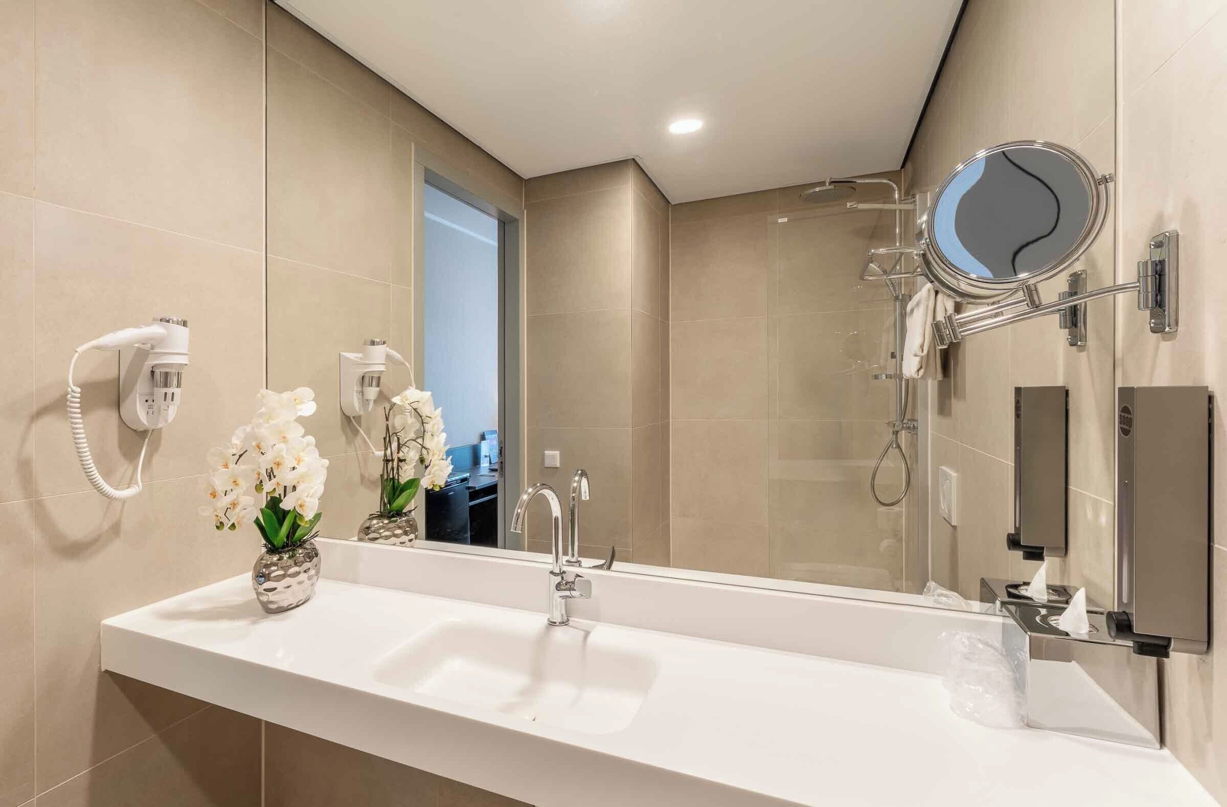 shower, rainfall showerhead, hair dryer, towels