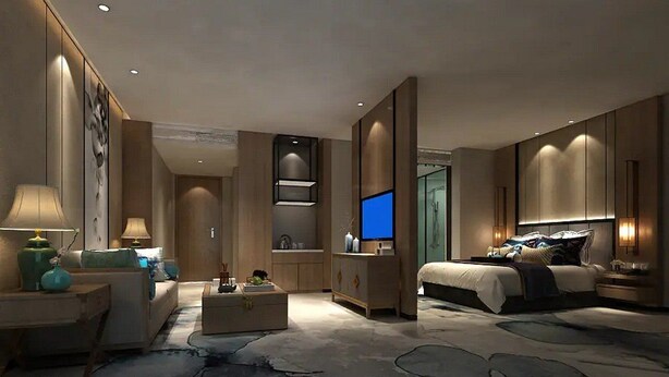 Une chambre d’hôtel moderne équipée d’un grand lit, d’une télévision, d’un canapé et d’un coin repas.