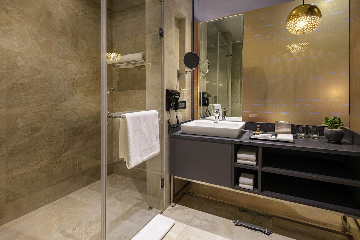 Eco-friendly toiletries, hair dryer, bathrobes, slippers